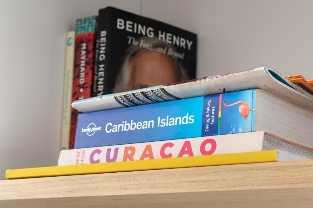 Curaçao travel guides on a table in the apartment